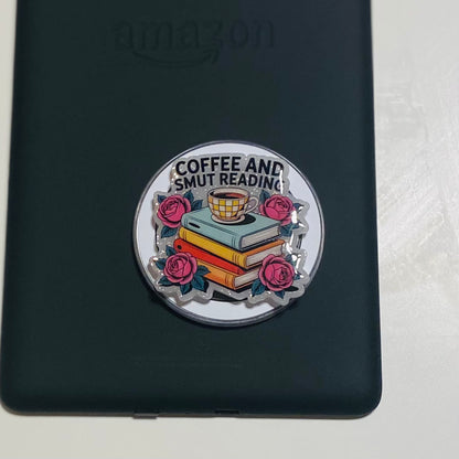 Magnetic e-reader phone grip with books, coffee cup, and roses