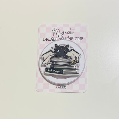 Magnetic e-reader phone grip with cat design on a checkered background