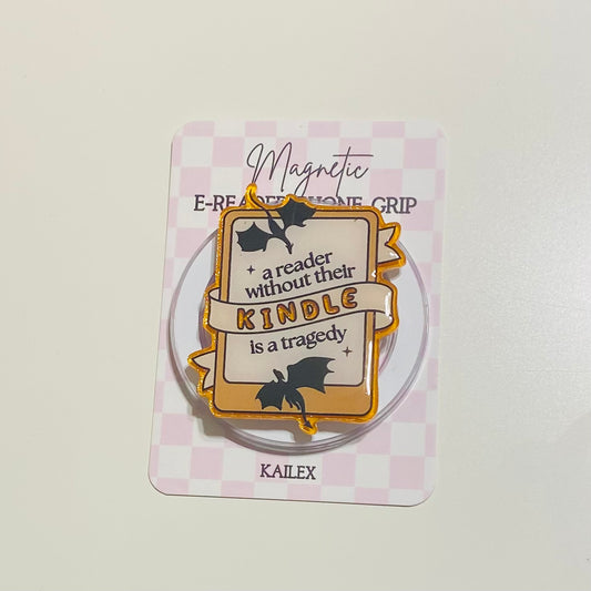 Magnetic e-reader phone grip with decorative design on a checkered background