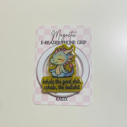 Magnetic e-reader phone grip with dragon design on a checkered card