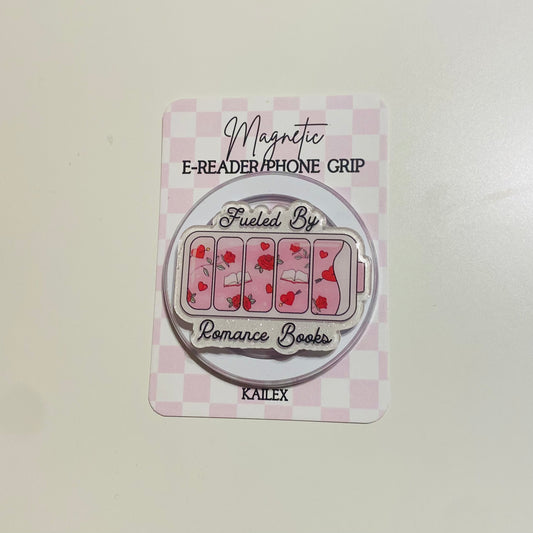 Magnetic e-reader phone grip with 'Fueled By Romance Books' design on a checkered background