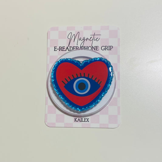 Heart-shaped e-reader phone grip with eye design on a checkered card, brand 'KAILEX' visible