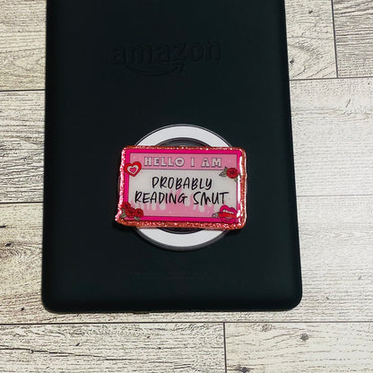 Magnetic e-reader phone grip with text