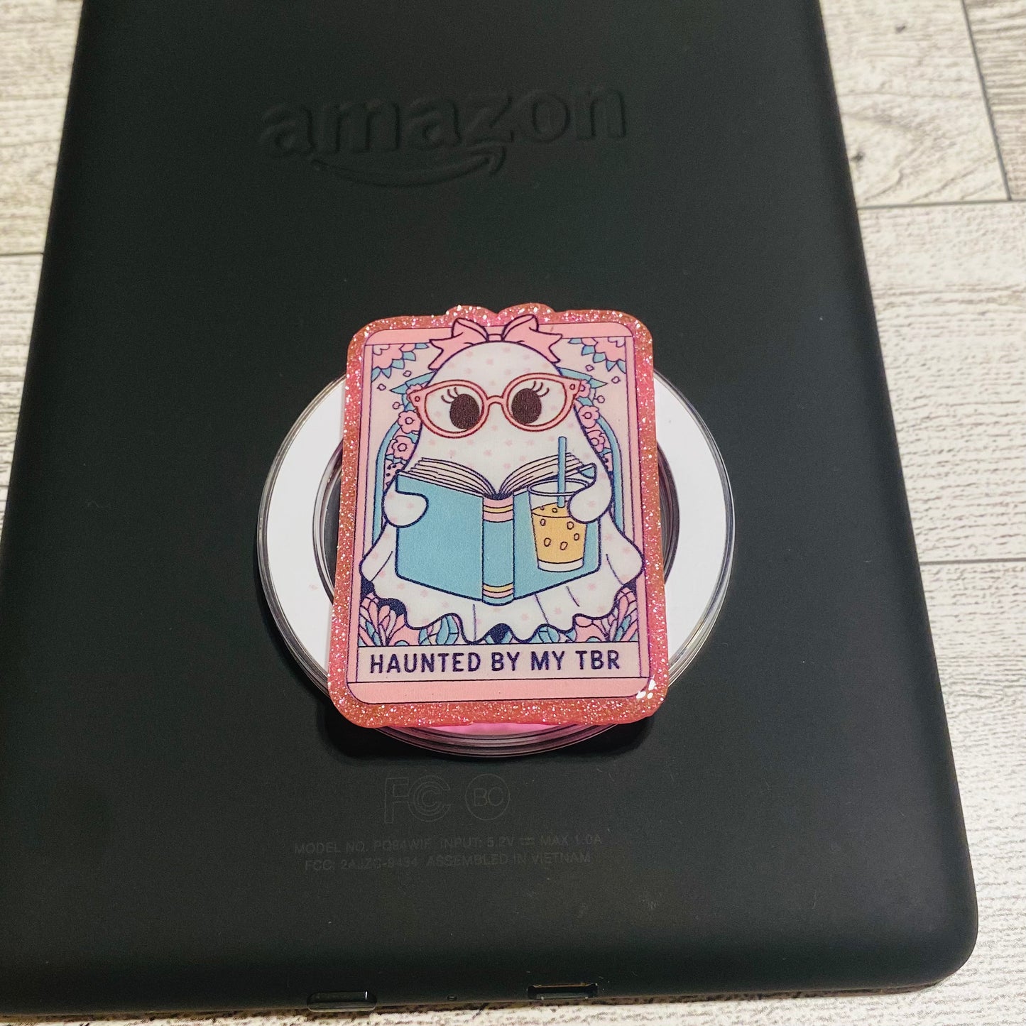Magnetic e-reader book grip with cartoon character