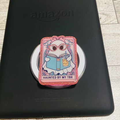 Magnetic e-reader book grip with cartoon character