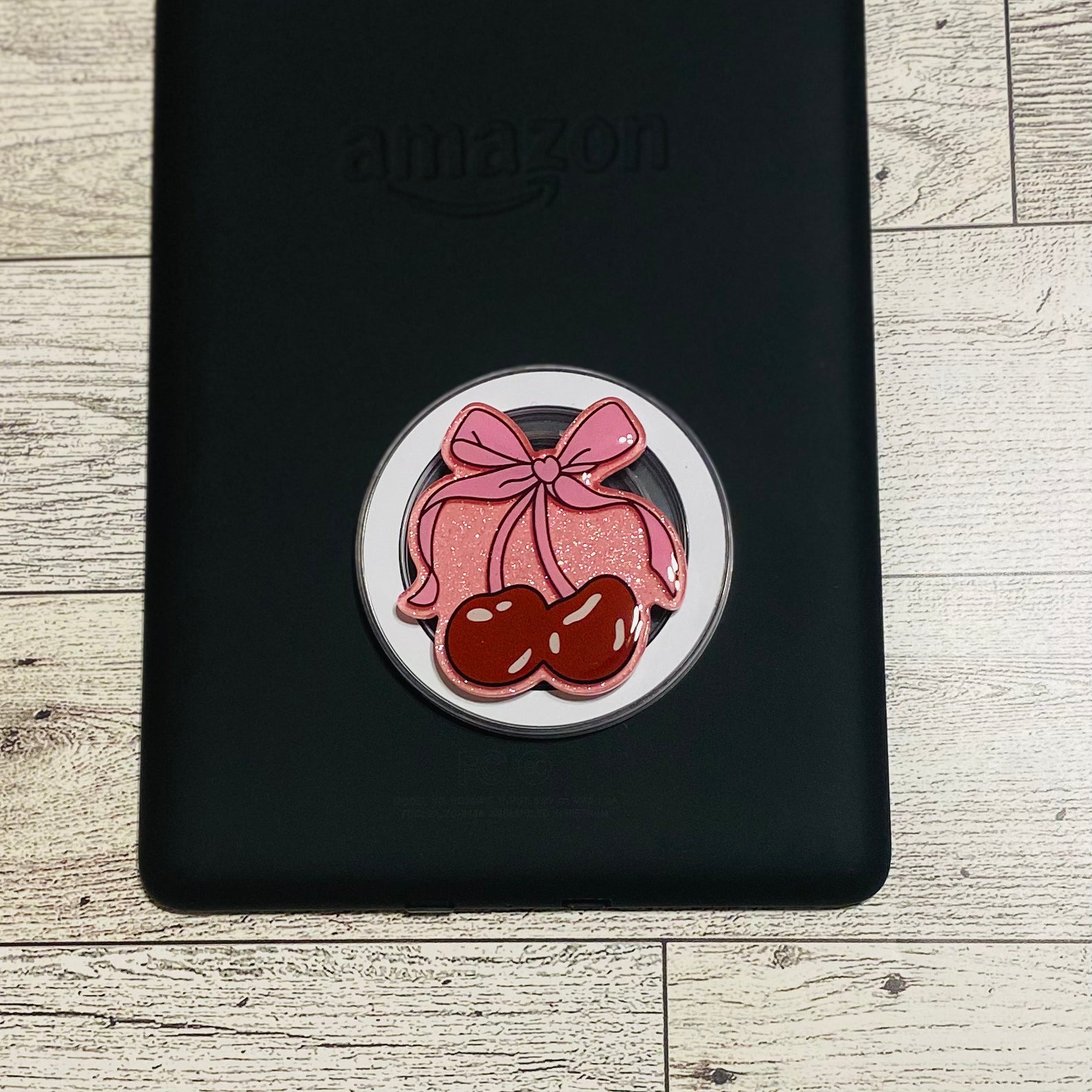 Magnetic e-reader phone grip with pink bow and cherries