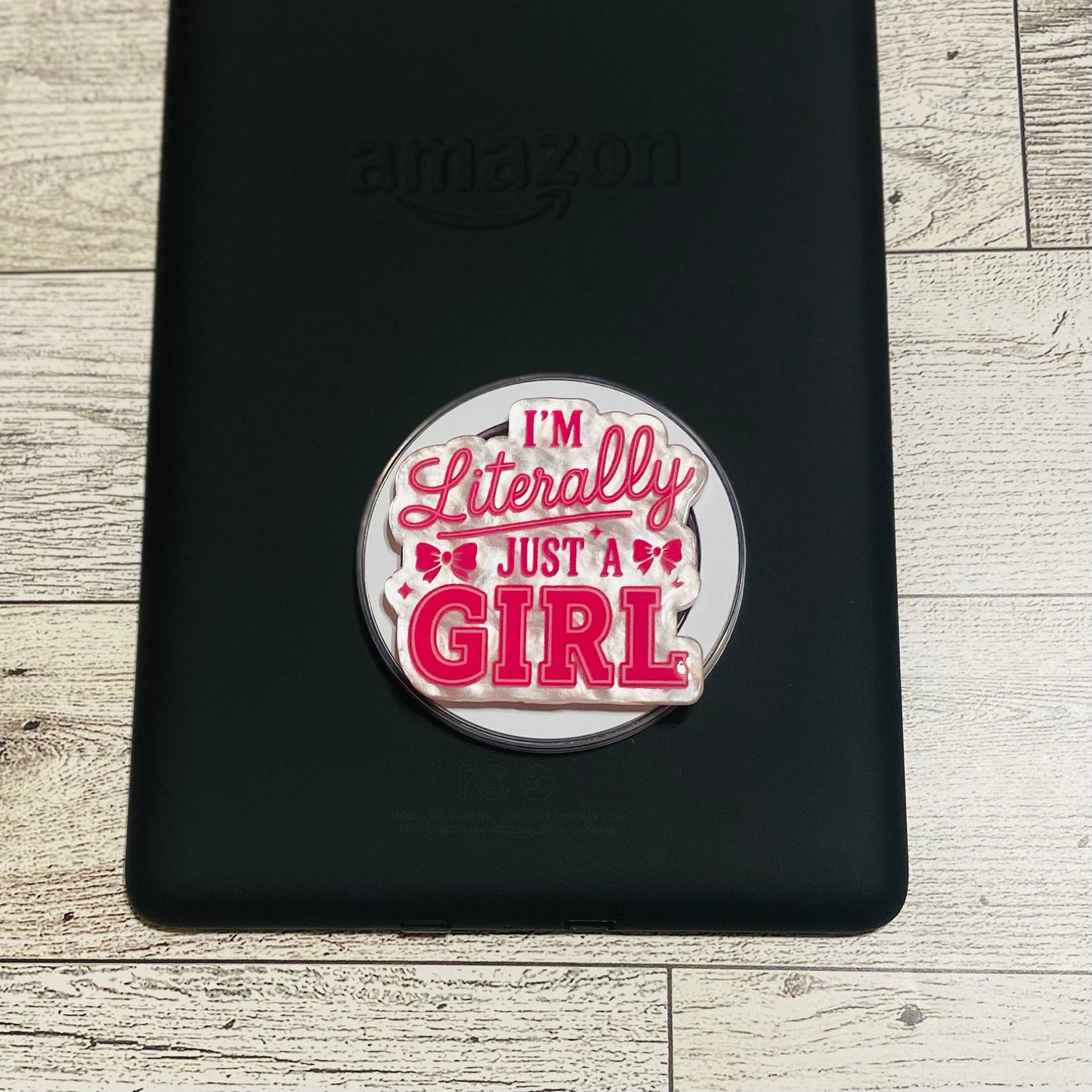 Magnetic e-reader/phone grip with 'I'm Literally Just a Girl' text 