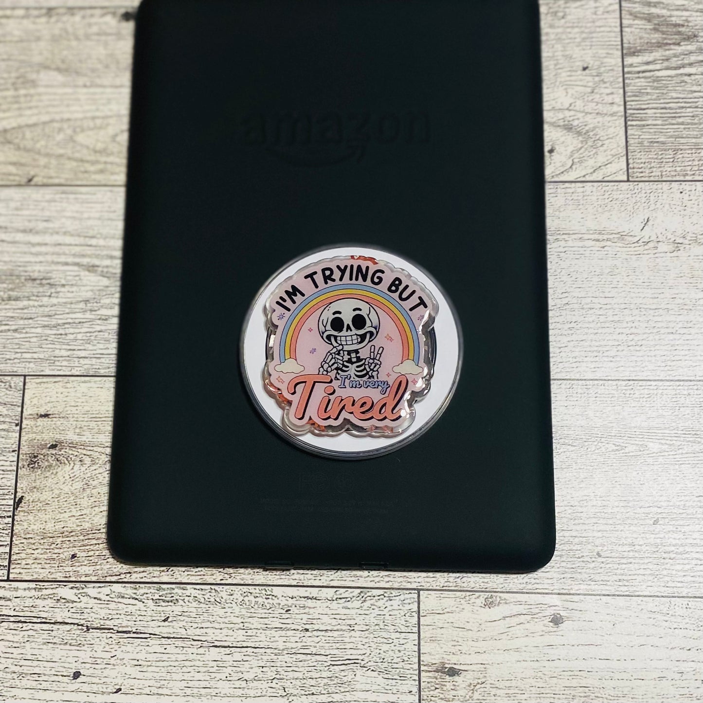 Magnetic e-reader phone grip with cartoon character and text