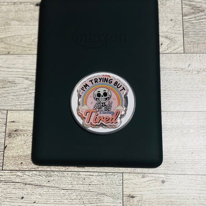 Magnetic e-reader phone grip with cartoon character and text