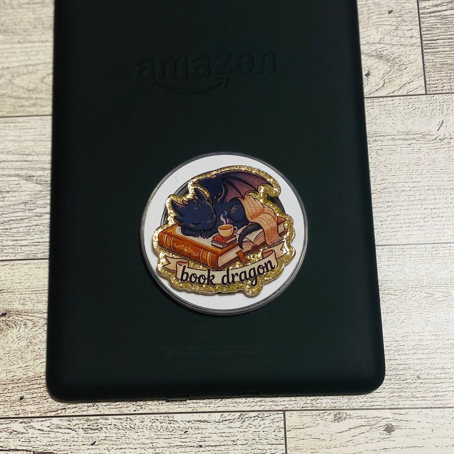  Magnetic e-reader phone grip with 'book dragon' design 