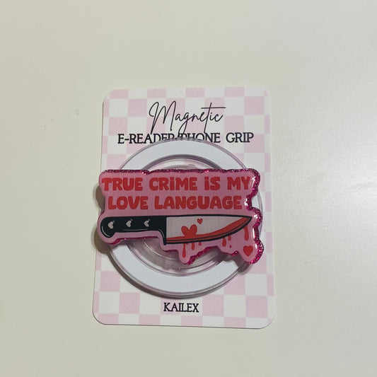 Magnetic e-reader phone grip with knife design and text on a checkered card