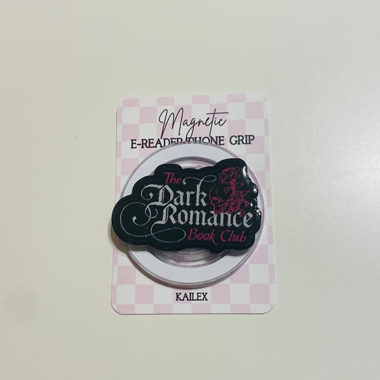 Magnetic e-reader phone grip with 'The Dark Romance Book Club' branding on a checkered background