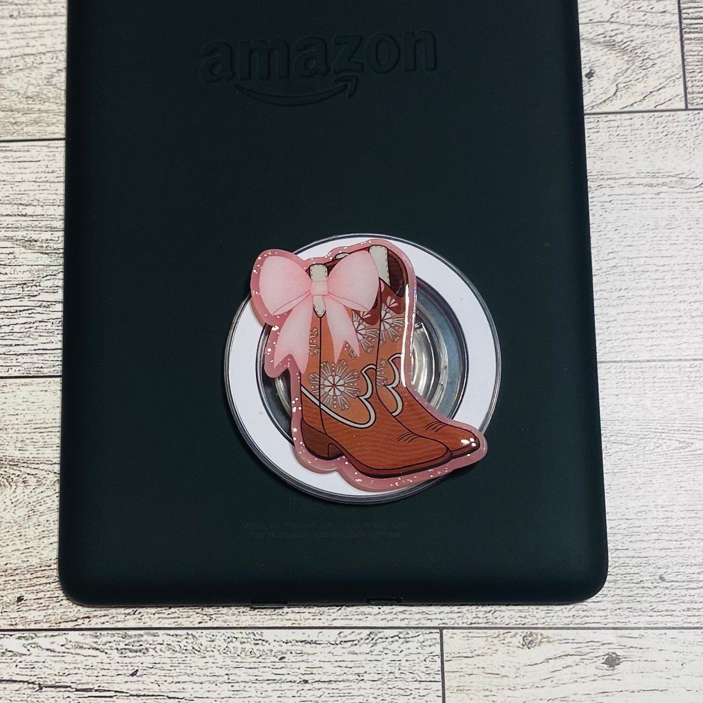 Magnetic e-reader phone grip with cowboy boot design