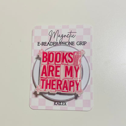 Magnetic e-reader phone grip with 'Books are my therapy' text on a checkered background