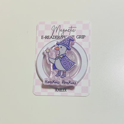 Magnetic e-reader phone grip with cartoon character on a checkered background
