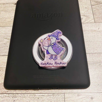 Magnetic e-reader phone grip with cartoon character
