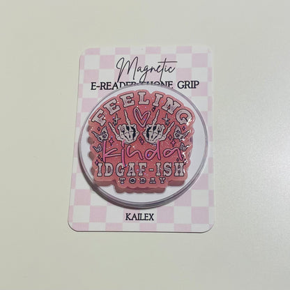 Magnetic e-reader phone grip with text on a checkered background