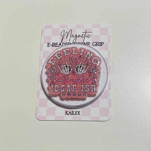 Magnetic e-reader phone grip with text on a checkered background