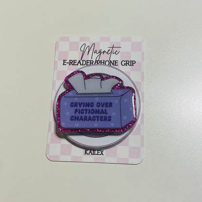Magnetic e-reader phone grip with purple design and text on a checkered card