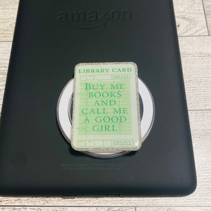 Magnetic e-reader book grip with green 'library card' design 