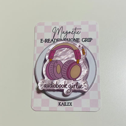 Magnetic e-reader phone grip with headphone design on a checkered background