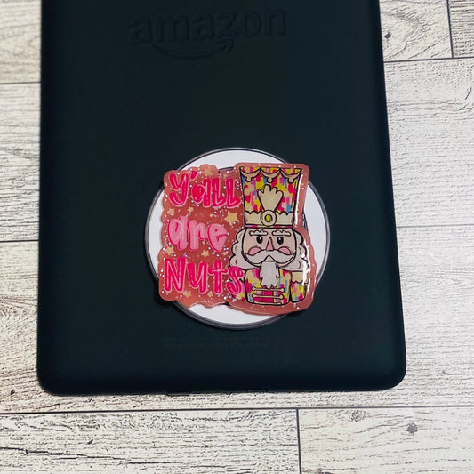 Magnetic e-reader silicone grip with nutcracker design and text on a checkered card