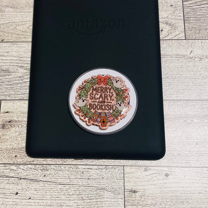Merry Scary and Bookish magnetic e-reader phone grip on a checkered card with KALEX branding.