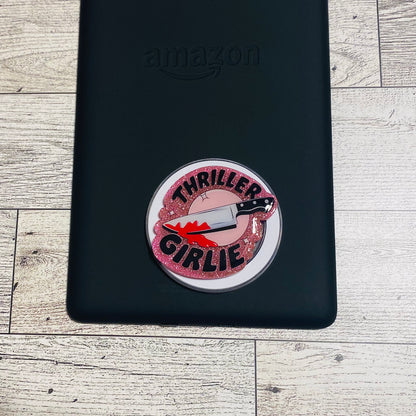 Pink glittery phone grip with 'Thriller Girlie' design on a checkered card, brand 'KAILEX' visible.