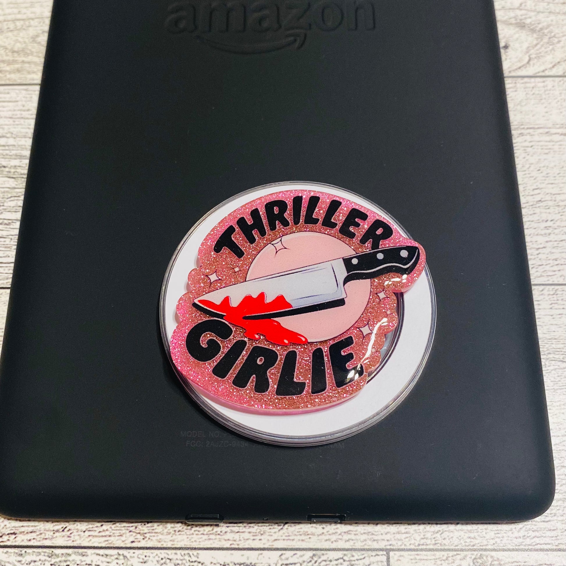 Pink glittery phone grip with 'Thriller Girlie' design on a checkered card, brand 'KAILEX' visible.