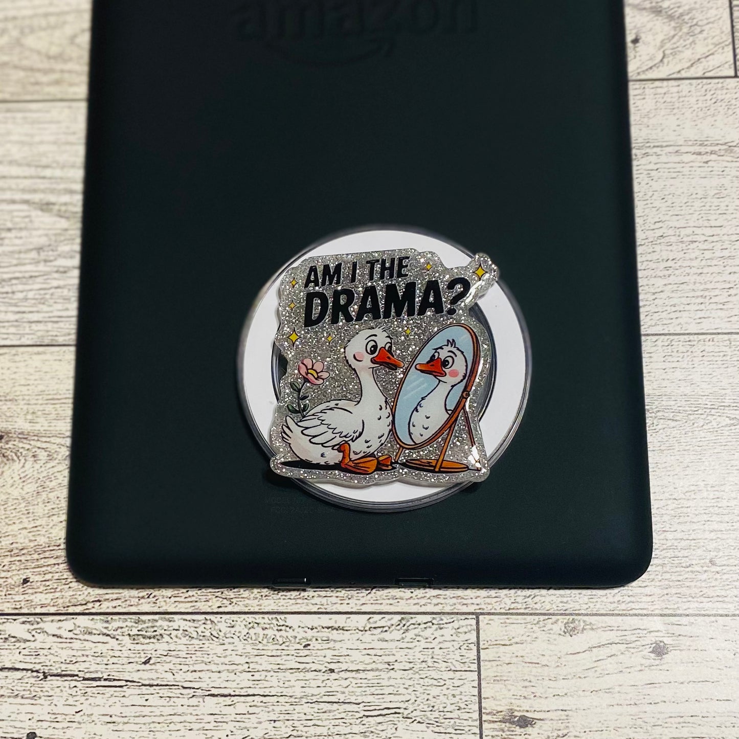 Magnetic e-reader phone grip with ducks and text on a checkered card