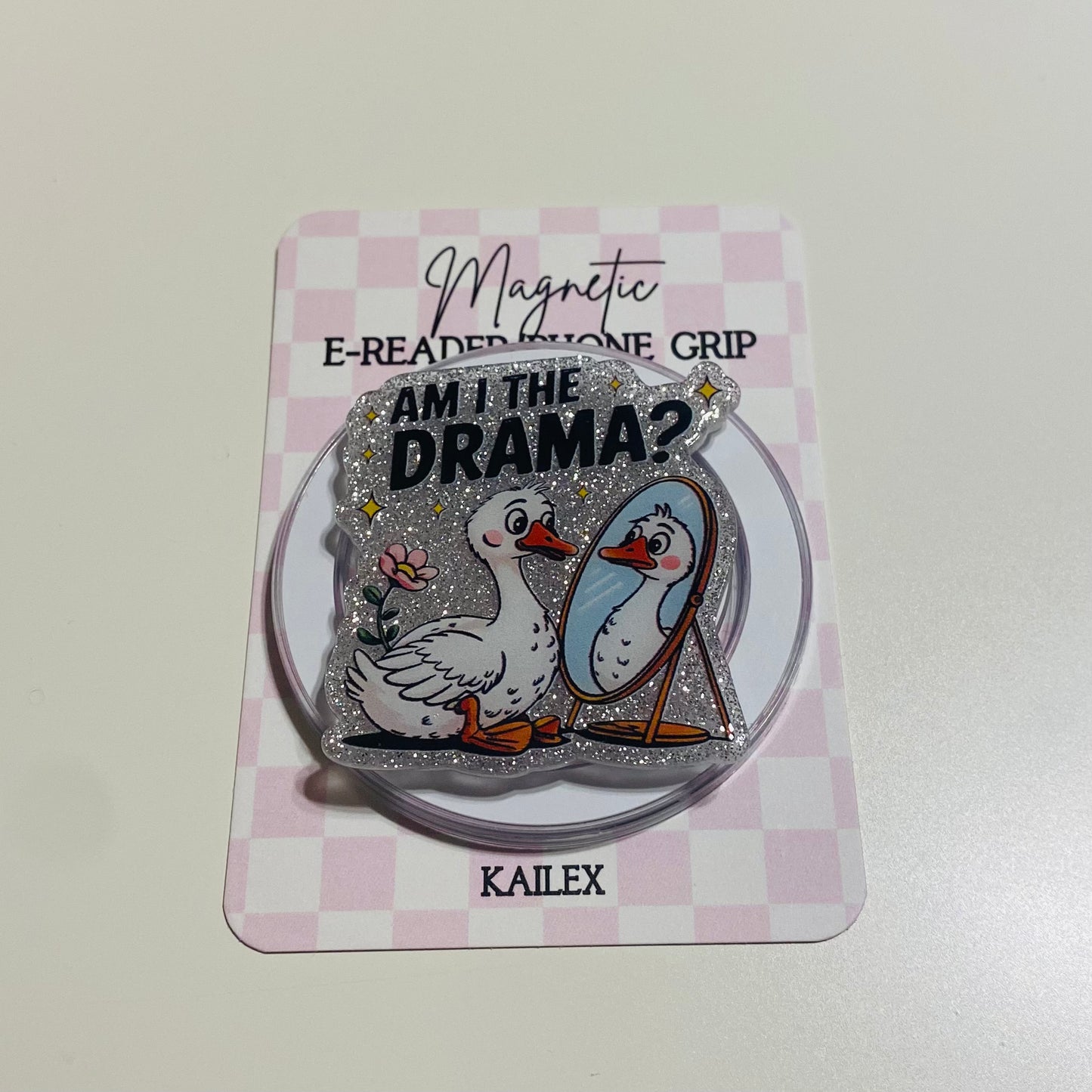 Magnetic e-reader phone grip with ducks and text on a checkered card