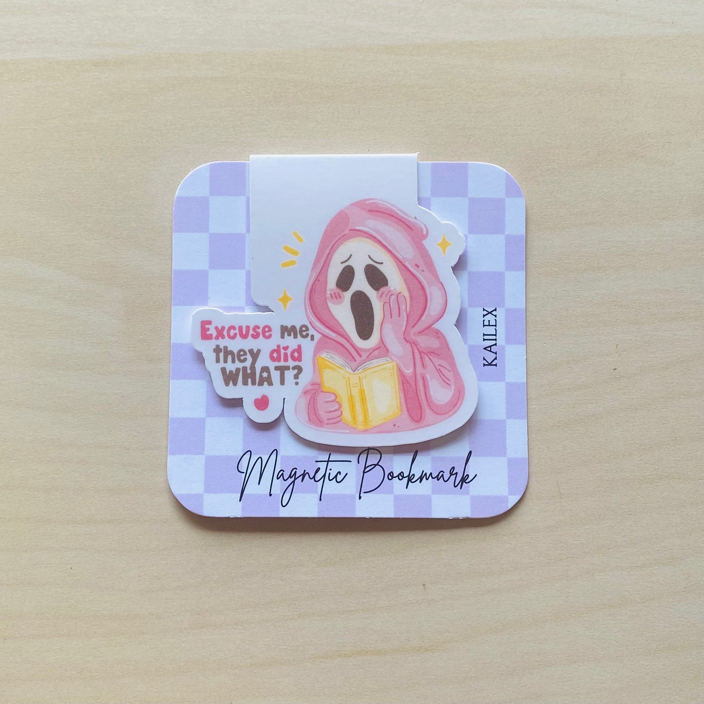 Excuse me, they did what? pink ghost reading yellow book Magnetic Bookmark