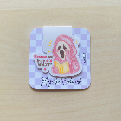 Excuse me, they did what? pink ghost reading yellow book Magnetic Bookmark